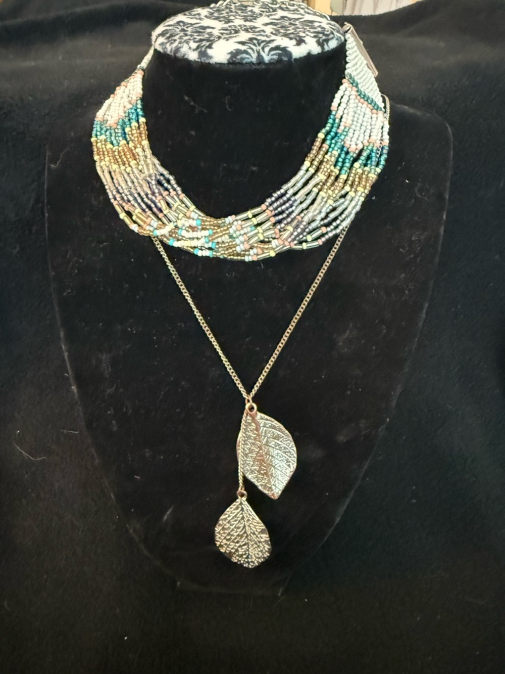 Multi-RowBeaded choker with long silver and brass tone Leaf Pendant necklace